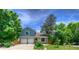 Charming two-story home with a well-manicured lawn and a two-car garage at 8140 S Storm King Peak, Littleton, CO 80127