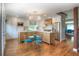 Spacious kitchen with white cabinets, stainless steel appliances, and modern light fixture at 8140 S Storm King Peak, Littleton, CO 80127