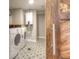 Convenient laundry room with modern washer and dryer and stylish tile flooring at 8140 S Storm King Peak, Littleton, CO 80127