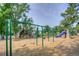 Community playground with swings, slides, and climbing structures, perfect for outdoor activities at 8140 S Storm King Peak, Littleton, CO 80127