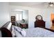 Bright bedroom features a ceiling fan, desk, and bookcase in adjoining area at 11883 E Fair Ave, Greenwood Village, CO 80111