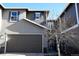 Charming home exterior with a two-car garage and decorative blue shutters at 11883 E Fair Ave, Greenwood Village, CO 80111