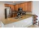 Granite countertops accent the spacious kitchen with stainless steel appliances at 11883 E Fair Ave, Greenwood Village, CO 80111