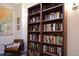 Library featuring built-in bookshelves and a comfortable armchair for reading at 11883 E Fair Ave, Greenwood Village, CO 80111