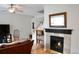 Inviting living room with a fireplace, hardwood floors, and bright natural light at 11883 E Fair Ave, Greenwood Village, CO 80111