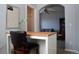 Office featuring a desk, lamp, and arched doorway to the living room at 11883 E Fair Ave, Greenwood Village, CO 80111