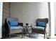 Cozy patio seating area with wicker chairs and a small accent table at 11883 E Fair Ave, Greenwood Village, CO 80111