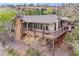 Stunning aerial view of the property showcasing the beautiful architecture, decks, and the surrounding landscape at 6093 Willowbrook Dr, Morrison, CO 80465