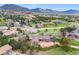 A charming home nestled in a lush landscape with picturesque mountain views, surrounded by mature trees and a tranquil setting at 6093 Willowbrook Dr, Morrison, CO 80465