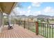 Spacious deck with mountain views offers an inviting space for outdoor relaxation and entertainment, furnished with comfortable seating at 6093 Willowbrook Dr, Morrison, CO 80465