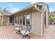 Inviting deck area with wood floors and stylish outdoor chairs, perfect for enjoying the views and relaxation at 6093 Willowbrook Dr, Morrison, CO 80465