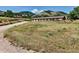 Picturesque view of a horse property featuring sprawling fields, fencing, and a barn in a tranquil setting at 6093 Willowbrook Dr, Morrison, CO 80465