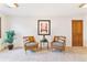 Bright living room with comfortable seating, neutral carpeting, and natural light creating a welcoming atmosphere at 6093 Willowbrook Dr, Morrison, CO 80465