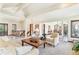 Bright and airy living room featuring open floor plan, stylish furnishings, and views into the dining area, perfect for entertaining at 6093 Willowbrook Dr, Morrison, CO 80465