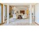 Spacious living room features a stone fireplace, large windows, and comfortable seating, creating a cozy and inviting atmosphere at 6093 Willowbrook Dr, Morrison, CO 80465