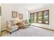 Cozy sitting room with natural light from large windows, comfortable armchairs, and stylish decor creating a relaxing atmosphere at 6093 Willowbrook Dr, Morrison, CO 80465