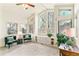 Bright sunroom with floor to ceiling windows at 6093 Willowbrook Dr, Morrison, CO 80465