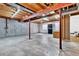 Unfinished basement with concrete flooring, exposed beams and support beams is ready for customization and offers ample storage at 275 S Pembrook St, Castle Rock, CO 80104