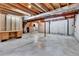 Unfinished basement with open ceiling, concrete floors, and ample storage space at 275 S Pembrook St, Castle Rock, CO 80104