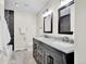 Updated bathroom boasts a stylish vanity with dual sinks and modern fixtures at 275 S Pembrook St, Castle Rock, CO 80104