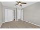 Neutral bedroom with a ceiling fan, closet, and a door leading to another room at 275 S Pembrook St, Castle Rock, CO 80104