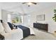 Bright bedroom with vaulted ceilings, large window, ceiling fan and gray dresser at 275 S Pembrook St, Castle Rock, CO 80104