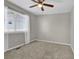 Bedroom featuring a ceiling fan and a window with white curtains and blinds at 275 S Pembrook St, Castle Rock, CO 80104