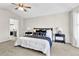 Comfortable bedroom featuring a ceiling fan, neutral color scheme, and plush carpeting at 275 S Pembrook St, Castle Rock, CO 80104