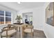 Open dining area shows seamless transition to the office area, offering a view of its elegant desk and decor at 275 S Pembrook St, Castle Rock, CO 80104