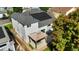 Aerial view of the back of the home featuring solar panels, a spacious deck with a pergola, and well-maintained landscaping at 275 S Pembrook St, Castle Rock, CO 80104