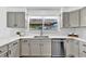 Bright kitchen features sleek countertops, stainless steel appliances, and stylish backsplash, creating a modern and functional space at 275 S Pembrook St, Castle Rock, CO 80104