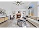 Bright living room features built-in shelving, a cozy fireplace, and a comfortable seating area, perfect for relaxation at 275 S Pembrook St, Castle Rock, CO 80104