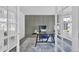 Elegant home office featuring wainscotting, neutral carpet, large desk, and a large window that provides natural light at 275 S Pembrook St, Castle Rock, CO 80104