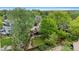 An aerial view reveals a lovely backyard with mature trees and a well-manicured lawn at 4269 Carter Trl, Boulder, CO 80301