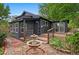 Charming backyard with a stone fountain, wooden deck, and lush landscaping at 4269 Carter Trl, Boulder, CO 80301