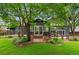 Beautiful backyard with a stone patio and a sliding door entrance surrounded by lovely greenery at 4269 Carter Trl, Boulder, CO 80301
