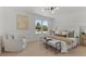 Bright bedroom with a window, upholstered bed frame, chair and two benches with a soft carpet at 4269 Carter Trl, Boulder, CO 80301