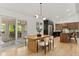 Bright dining room area with lots of natural light, light hardwood floors, and an open staircase at 4269 Carter Trl, Boulder, CO 80301