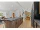 Open floor plan with views of the kitchen and dining area, featuring stainless appliances and an island at 4269 Carter Trl, Boulder, CO 80301
