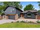 Charming two-story home with a stylish gray exterior, stone accents, and a well-manicured front yard at 4269 Carter Trl, Boulder, CO 80301