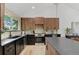 Bright kitchen with stainless appliances, dark countertops, and lots of natural light from the window at 4269 Carter Trl, Boulder, CO 80301