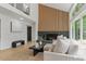 Bright living room with natural light streaming through the large windows and modern fireplace at 4269 Carter Trl, Boulder, CO 80301