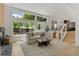 Bright living room features an open layout with large windows and an adjacent dining area at 4269 Carter Trl, Boulder, CO 80301