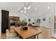 Open concept living room and dining area with modern decor and updated stainless appliances in the kitchen at 4269 Carter Trl, Boulder, CO 80301