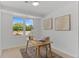 Bright office with a desk, chair, artwork, and large windows showing landscaping at 4269 Carter Trl, Boulder, CO 80301
