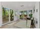 Light-filled sunroom featuring walls of windows with views of the deck and backyard at 4269 Carter Trl, Boulder, CO 80301