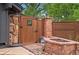 This backyard features a wooden gate, stone pathway, and fire pit at 4269 Carter Trl, Boulder, CO 80301