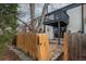 Exterior view of townhouse with a fenced-in backyard and patio at 11645 Lincoln St, Northglenn, CO 80233