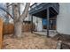 Spacious backyard features a covered patio and mature trees at 11645 Lincoln St, Northglenn, CO 80233