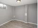 This finished basement area has wood-look floors and a small window at 11645 Lincoln St, Northglenn, CO 80233